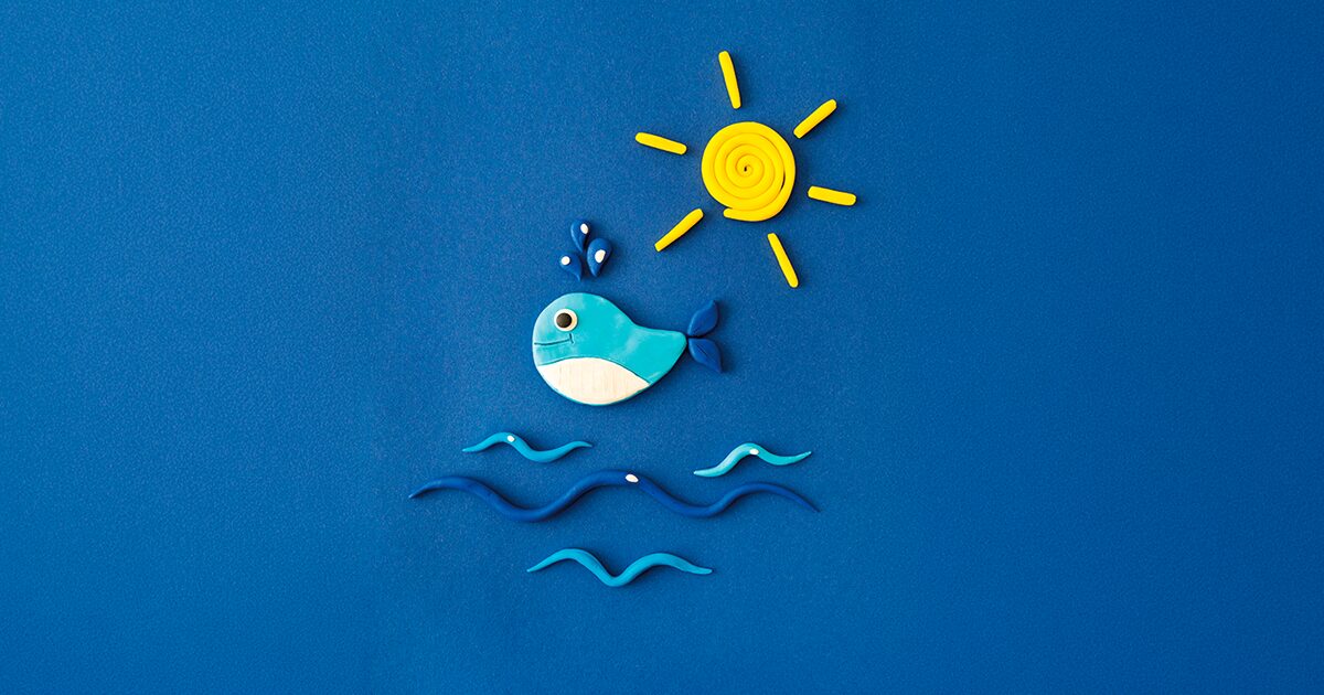 illustration enfantine d'une baleine au dessus des vagues sous un soleil